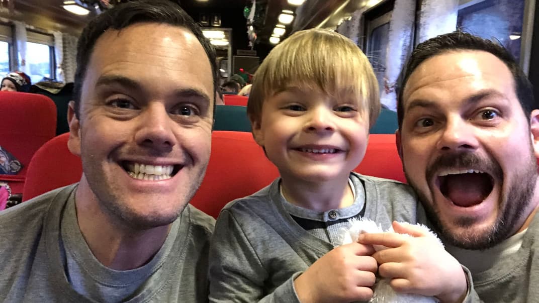 Брайан Фурц (слева), Лимайкл Маклин (справа) и их сын