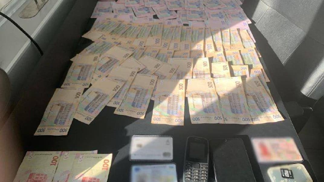Гроші, які знайшли в одного з учасників схеми