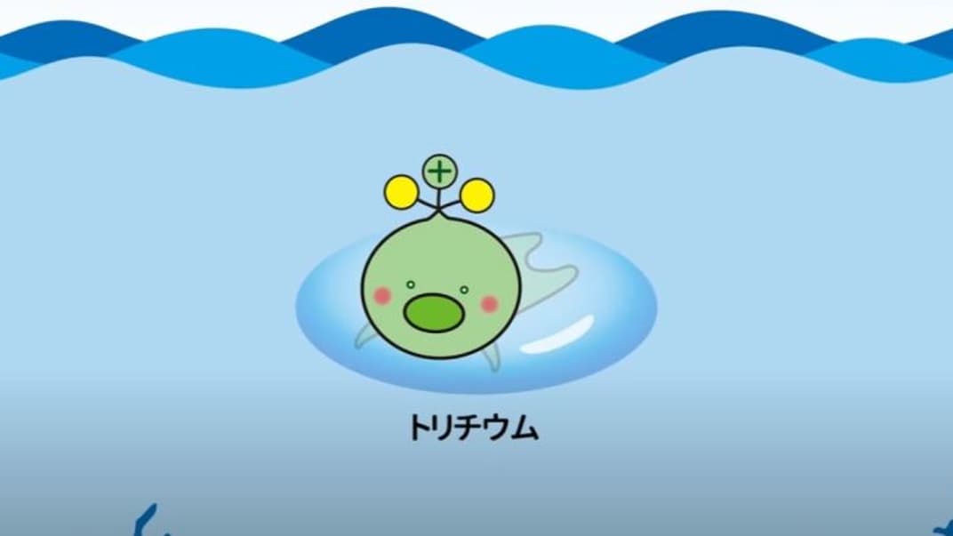 Маскот Тритий-кун, изображающий тритий