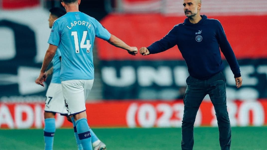Захисник «Манчестер Сіті» Емерік Ляпорт (ліворуч) та головний тренер команди Хосеп Гвардіола