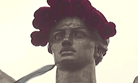 Climbers Placed A Poppy Wreath On A Giant Monument in Kyiv