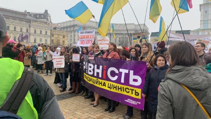 Women's March participants holding up a banner that reads 'Equality - Our Traditional Value' at the Women's March in Kyiv, Ukraine. March 8, 2020