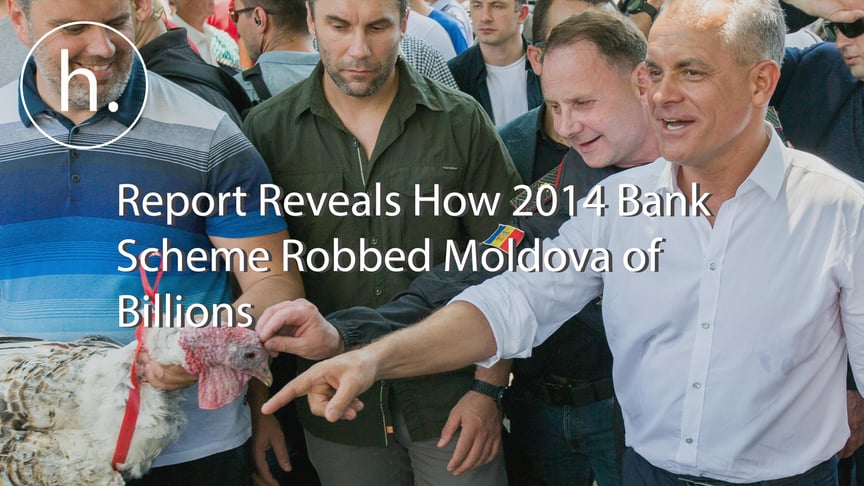 The leader of the Democratic Party of Moldova Vladimir Plahotniuc (R) gestures next to a supporter holding a turkey, before his supporters will throw them over the fence of presidential building, as a sign of contempt and dishonor of the President, in Chisinau, Moldova on June 9, 2019.