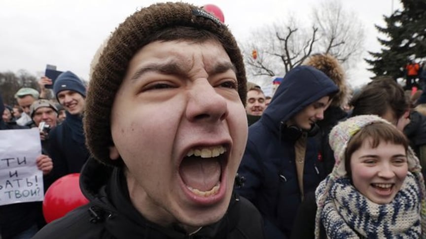 Russian OMON trying to get students down from the lamppost, protesters in downtown Moscow on 26 March. Mass demonstrations took place that day in multiple Russian cities demanding resignation of Russian Prime Minister Dmitry Medvedev, who was accused of corruption.