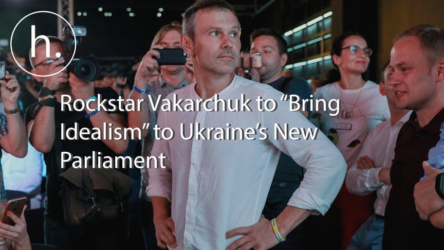 Members of President Volodymyr Zelenskyy's team watch the early exit poll results being presented at their headquarters in Kyiv, Ukraine on July 21, 2019.