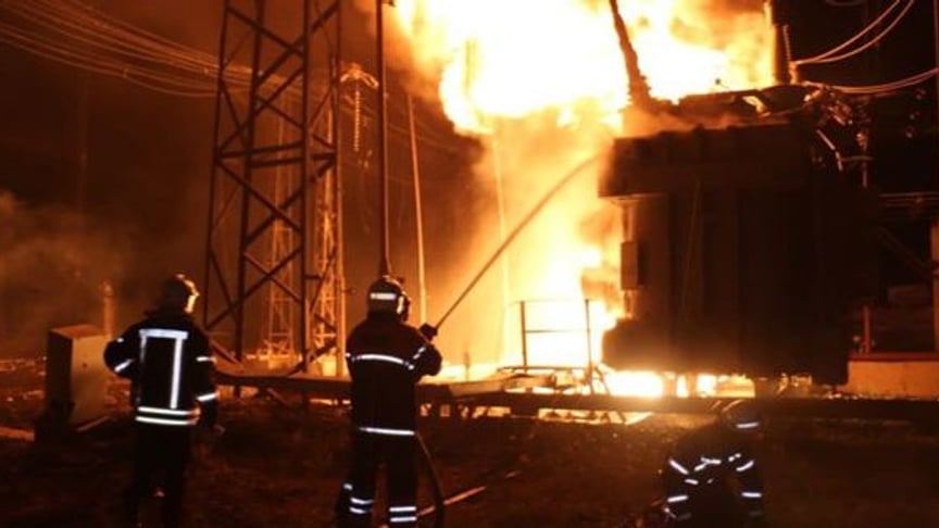 Rescue workers work at the site of Russian shelling, September 11, 2022