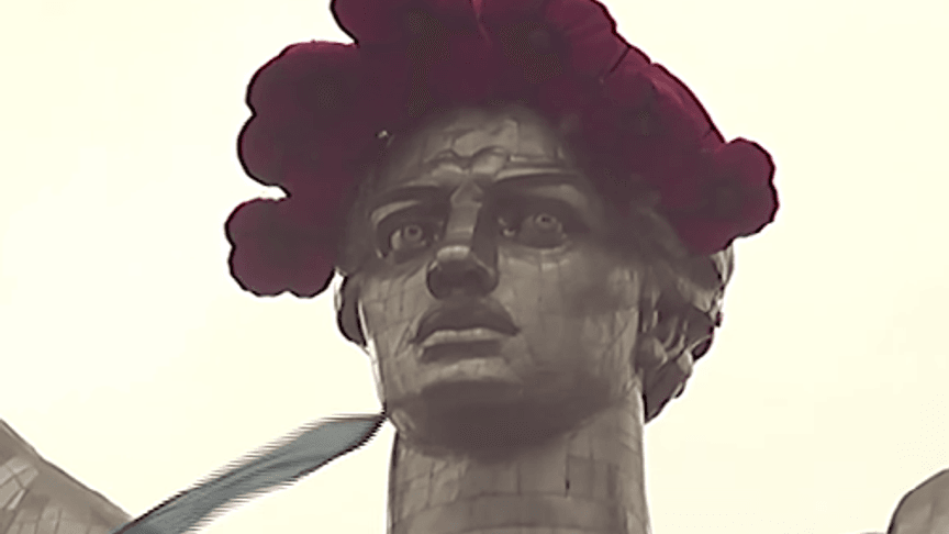 Climbers Placed A Poppy Wreath On A Giant Monument in Kyiv