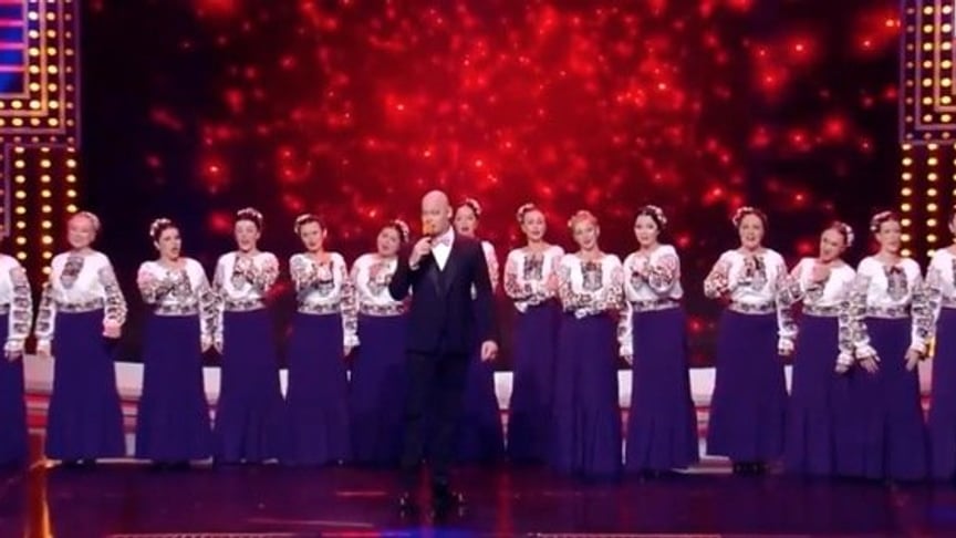 National choir Veryovka and Kvartal 95 leader Yevhen Koshovyi perform "Horila hata" ('A House Was Burning') on stage in Kyiv, Ukraine on October 19.