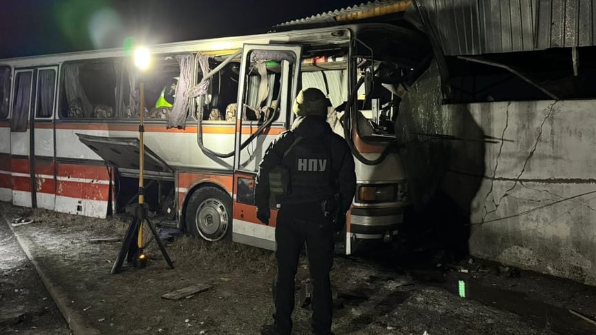 Police officers work at the site of the Russian attack in Ternivka