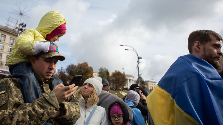 People attend a rally against President Volodymyr Zelenskyy's peace plan for Donbas on October 6 in Kyiv, Ukraine.