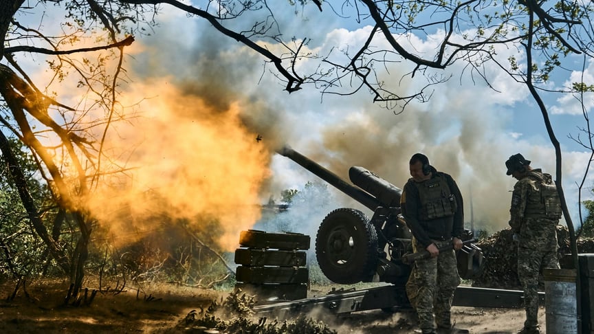 Ukrainian soldiers fire a cannon near Bakhmut, May 12, 2023