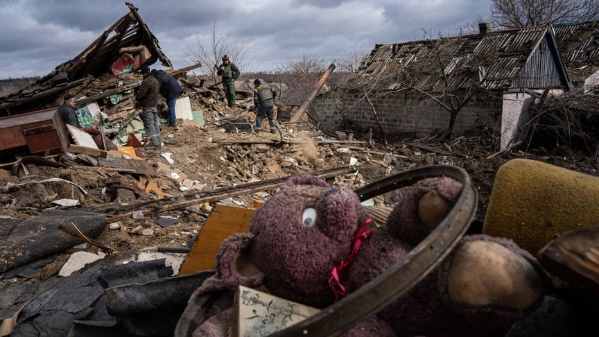The owners and their neighbors clear the rubble of a house destroyed by a Russian missile in the village of Maksymilianivka, Donetsk Oblast, February 21, 2023.