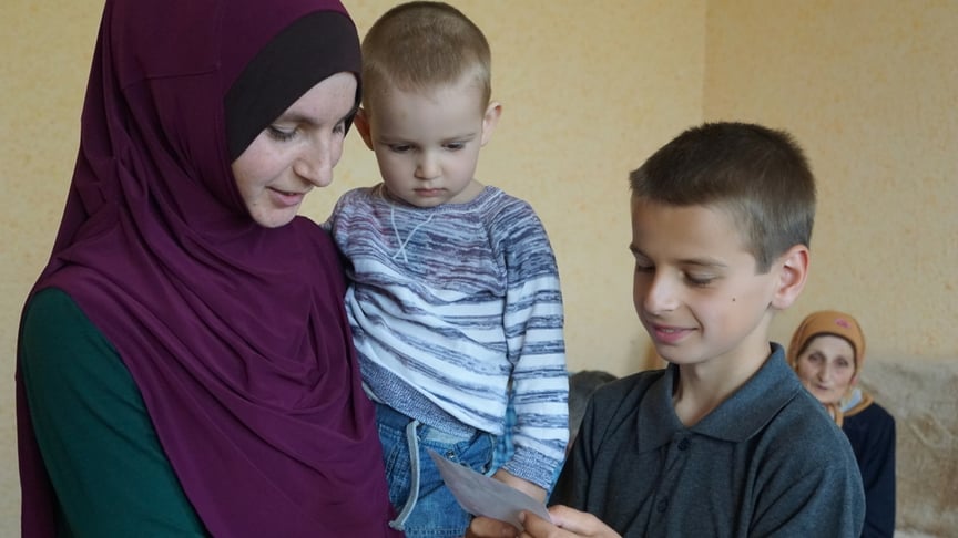 Musa and Muhammad Suleymanov with their mother Elzara.