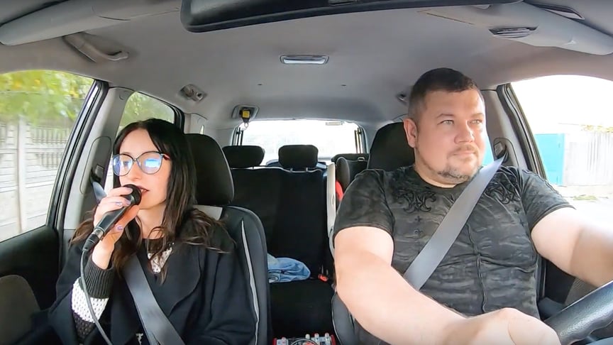 Passenger Olesia takes a ride in Andrey Turko's karaoke taxi.