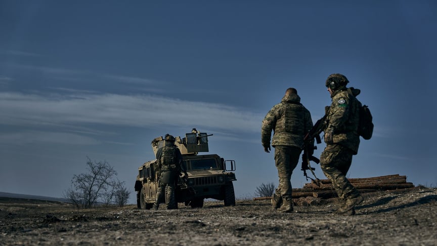 Soldiers of the 3rd Air Assault Brigade of the Armed Forces of Ukraine near their armored vehicle at a position near Bakhmut, February 11, 2023