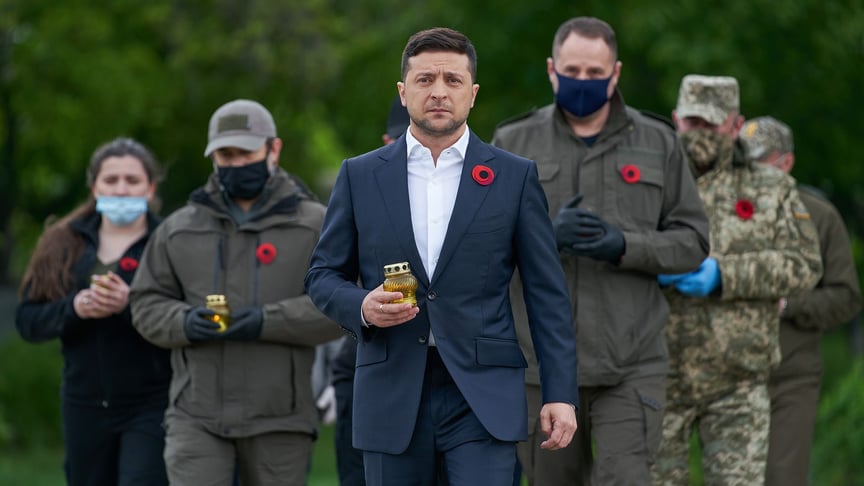 Ukrainian President Volodymyr Zelenskyy (C) during a memorial event for Victory in Europe Day in Milove, Luhansk region, Ukraine on May 8.