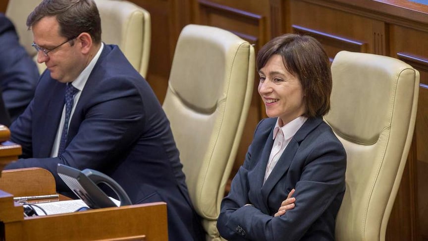 The Prime Minister of Moldova Maia Sandu (R) with Andrei Nastase (L) pictured in Parliament during audition at a special session in Chisinau, Moldova, 12 November 2019. The government of Maia Sandu lost a vote of non-confidence from 63 deputies, socialists and democrats. Socialists sent censure motion against the government, after their legislative amendments to the Law of the Prosecutor's Office that give them the right to refer candidates for the post of Attorney General.