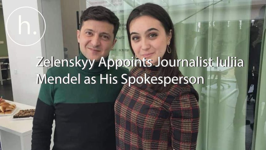 Ukrainian journalist Iuliia Mendel (R) stands alongside the President of Ukraine Volodymyr Zelenskyy.