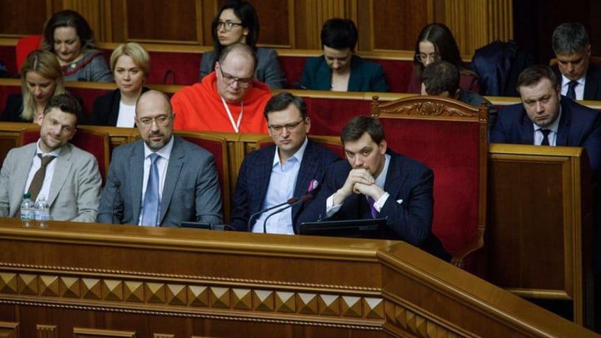 Ministers of the old and new Cabinet sit together at the government's bench in Parliament during the vote to recall Oleksiy Honcharuk's government (right-most on the first row) and the installation of a new government led by Denys Shmygal (second from the left on the first row.) Kyiv, Ukraine, March 4, 2020.
