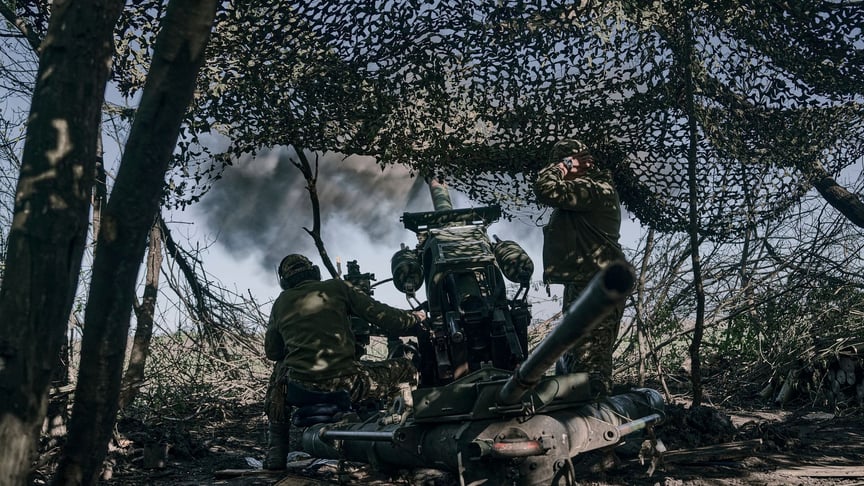 Ukrainian soldiers fire a cannon near Bakhmut, a town in the east of the country where fierce fighting against Russian troops continues, in Donetsk Oblast, Ukraine, May 3, 2023