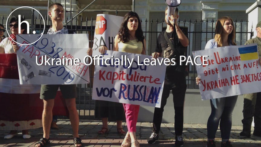 Demonstrators stage a protest outside the Austrian embassy in Kyiv on June 25, 2019.