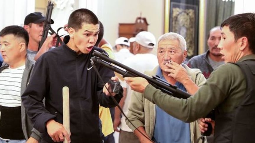 Supporters of ex-president Almazbek Atambayev guard his house in the village of Koy near Bishkek, Kyrgyzstan, August 7, 2019.
Photo: EPA-EFE/IGOR KOVALENKO