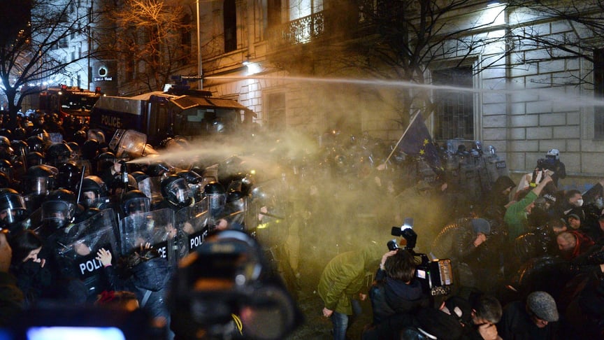 Police use tear gas and water cannons against protesters near the Georgian parliament building in Tbilisi, March 7, 2023