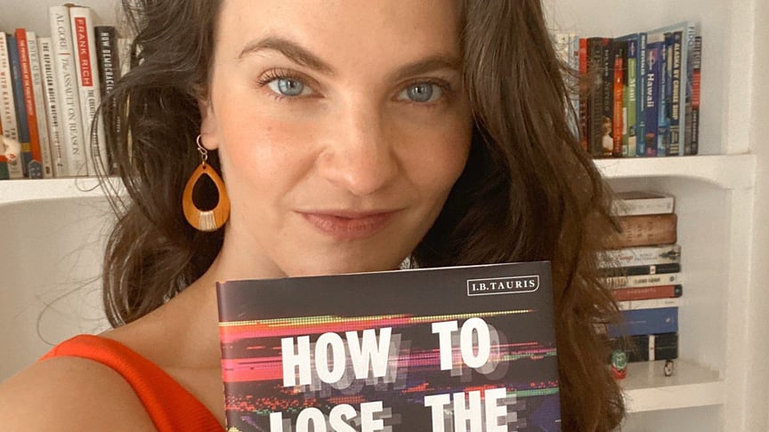 Wilson Center researcher Nina Jankowicz poses with her book "How to Lose The Information War" on Russia's influence in Ukraine, Poland, Czechia, Georgia and Estonia. The books came out in July 2020.