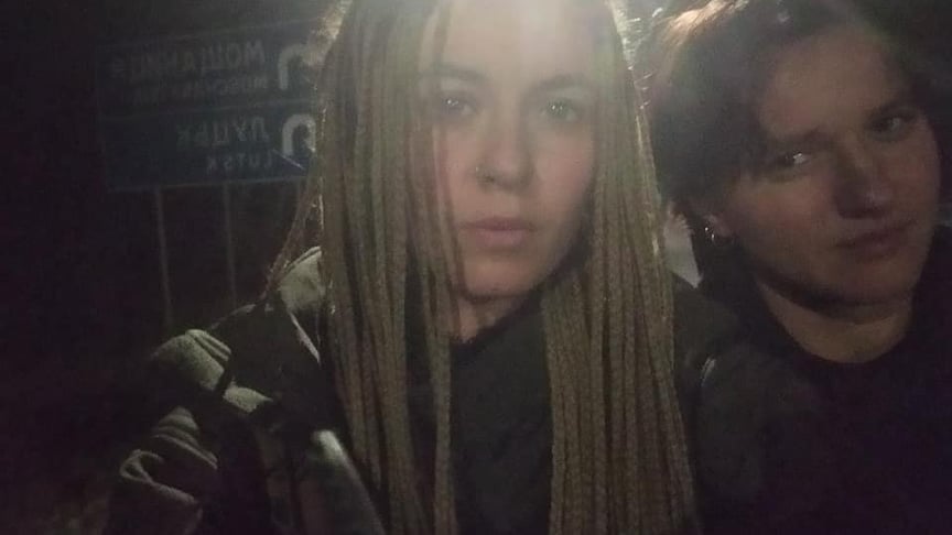Yaryna Chornohuz (L), a volunteer medic from the Hospitallers battalion, and aerial scout Nastya Konfederat were left on the side of the highway following a dispute triggered by their request to turn off a Russian television show playing in the bus they were travelling on.
