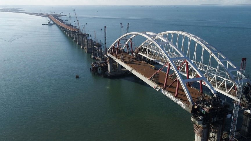 The now-completed Kerch Strait Bridge, crossing the Azov Sea, under construction. The Kerch Strait Bridge, built by the Russian occupiers, now connects Crimea to mainland Russia.